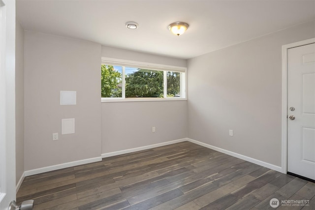 16011 Sunnyside Ave N, Shoreline, WA 98133 - spare room featuring dark wood-style flooring and baseboards