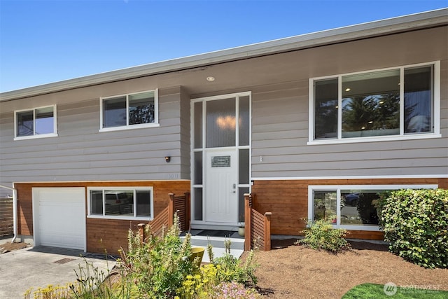 16011 Sunnyside Ave N, Shoreline, WA 98133 - view of front of home featuring a garage and concrete driveway