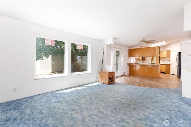 212S 3rd St, Almira, WA 99103 - unfurnished living room featuring light carpet and ceiling fan