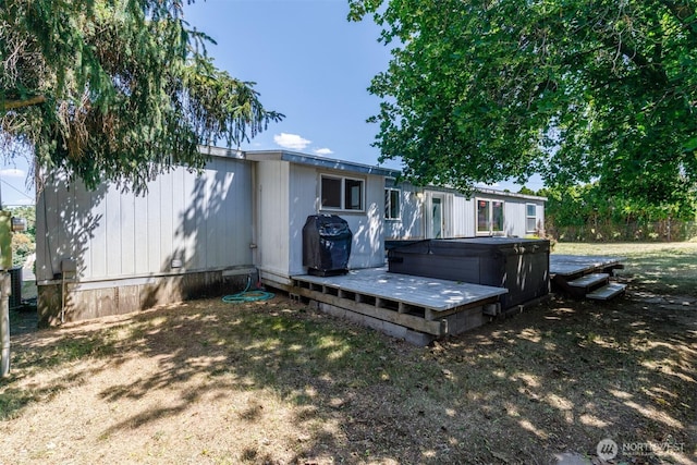 212S 3rd St, Almira, WA 99103 - rear view of property with a hot tub and a wooden deck