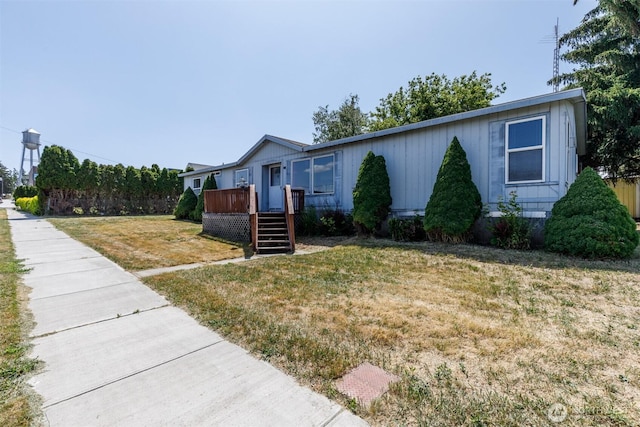 212S 3rd St, Almira, WA 99103 - view of front of property with a deck and a front lawn