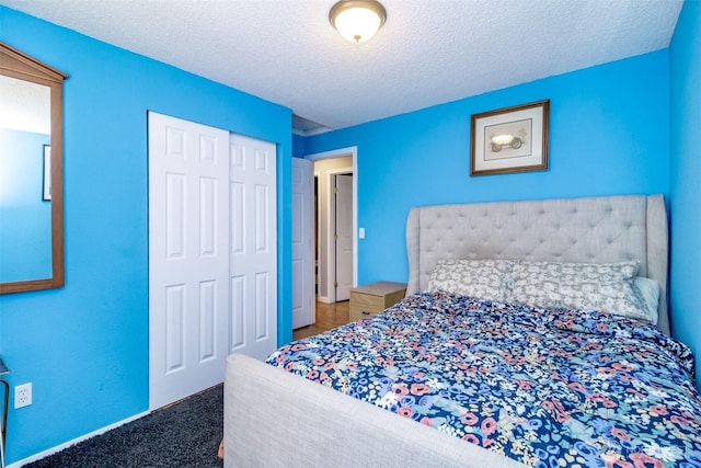 1938 66th Ave NE, Tacoma, WA 98422 - bedroom featuring a closet, a textured ceiling, and carpet floors