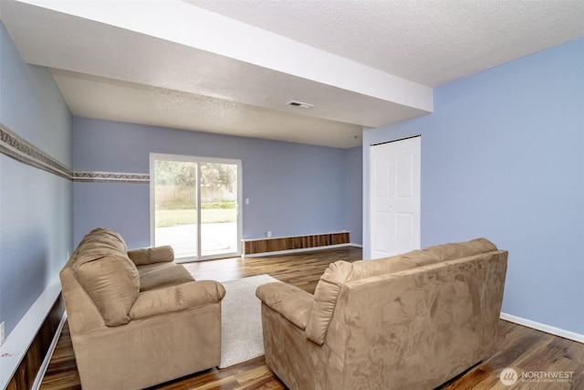 1938 66th Ave NE, Tacoma, WA 98422 - living room with wood finished floors and a textured ceiling