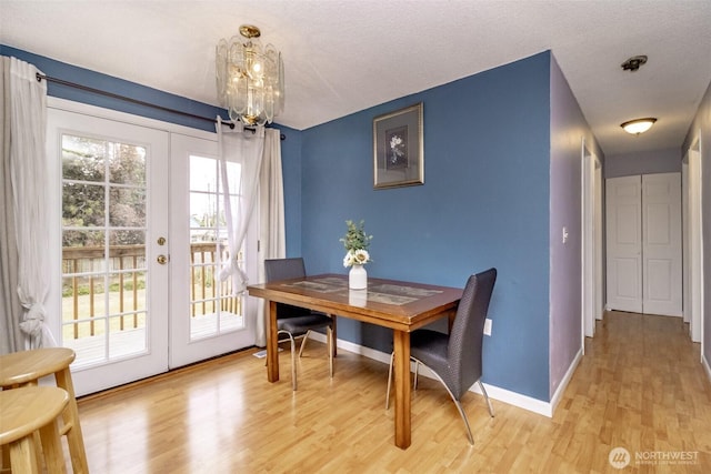 1938 66th Ave NE, Tacoma, WA 98422 - dining space with french doors, light wood finished floors, and a chandelier
