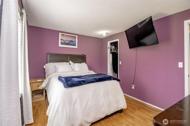 1938 66th Ave NE, Tacoma, WA 98422 - bedroom featuring light wood-style flooring and a textured ceiling