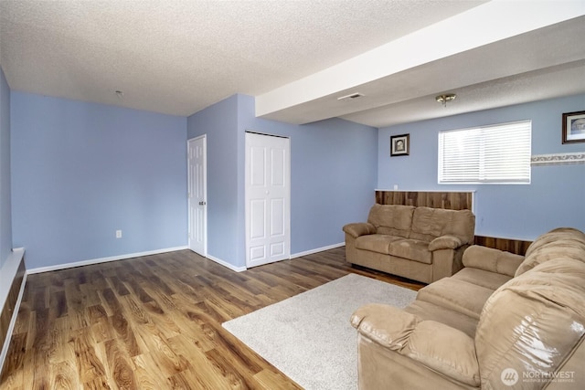 1938 66th Ave NE, Tacoma, WA 98422 - living area with wood finished floors and a textured ceiling