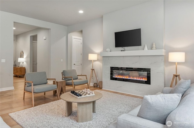 4561 Albatross St, Port Townsend, WA 98368 - living area featuring a tile fireplace, wood finished floors, and recessed lighting