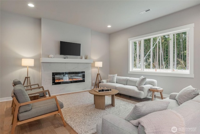 4561 Albatross St, Port Townsend, WA 98368 - living area with a tile fireplace, wood finished floors, and recessed lighting