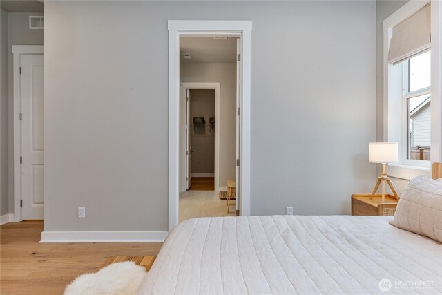 4561 Albatross St, Port Townsend, WA 98368 - bedroom with wood finished floors and a walk in closet