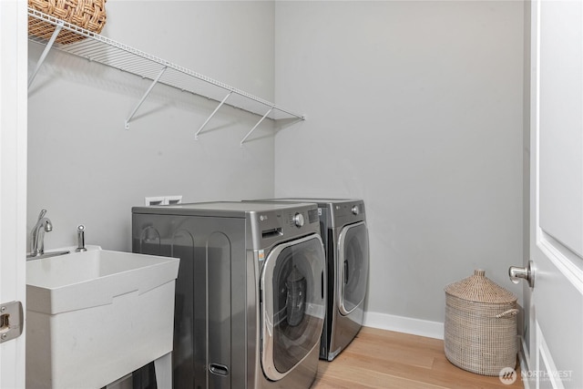 4561 Albatross St, Port Townsend, WA 98368 - laundry area with separate washer and dryer and light wood finished floors