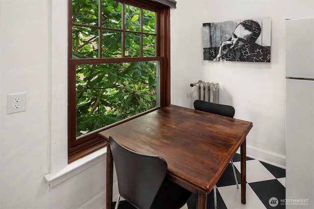 408 Bellevue Ave E Unit 306, Seattle, WA 98102 - dining space with radiator and tile patterned floors