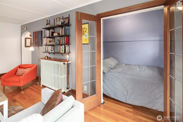 408 Bellevue Ave E Unit 306, Seattle, WA 98102 - bedroom with radiator heating unit and wood finished floors