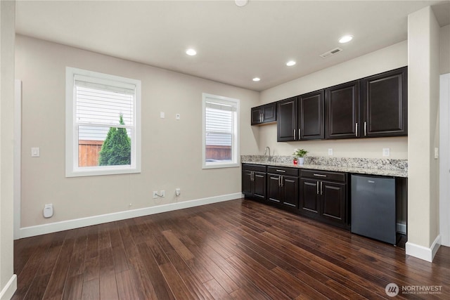 4410 Sentinel Ct, Gig Harbor, WA 98332 - kitchen featuring fridge, dark wood finished floors, light stone countertops, and recessed lighting