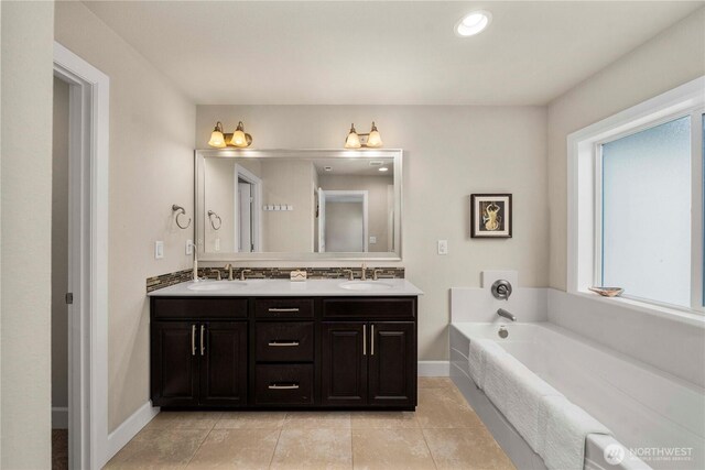 4410 Sentinel Ct, Gig Harbor, WA 98332 - bathroom featuring double vanity, a garden tub, tile patterned flooring, and decorative backsplash
