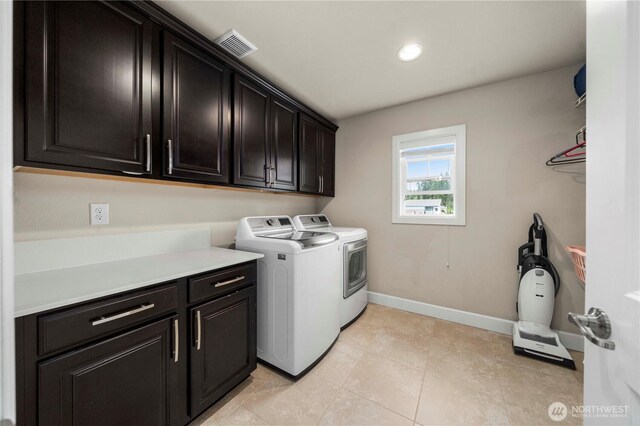 4410 Sentinel Ct, Gig Harbor, WA 98332 - laundry area featuring cabinet space, washer and clothes dryer, recessed lighting, and light tile patterned floors