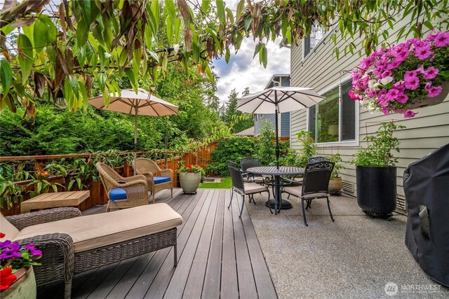 4410 Sentinel Ct, Gig Harbor, WA 98332 - wooden deck with outdoor dining area and area for grilling
