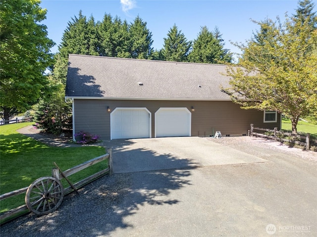 8012 105th Ave SW, Olympia, WA 98512 - view of front of house featuring driveway, a garage, and a shingled roof
