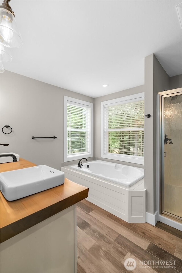 8012 105th Ave SW, Olympia, WA 98512 - full bath featuring a shower stall, a garden tub, wood finished floors, and vanity
