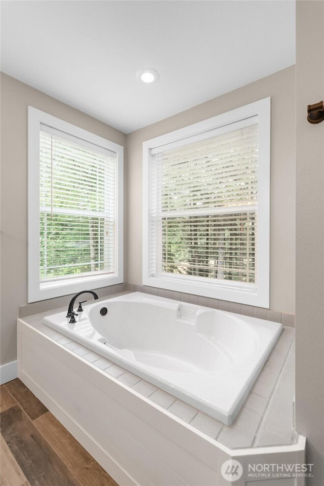8012 105th Ave SW, Olympia, WA 98512 - full bathroom featuring wood finished floors and a garden tub