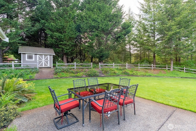 8012 105th Ave SW, Olympia, WA 98512 - fenced backyard with outdoor dining space, a patio area, and a storage shed