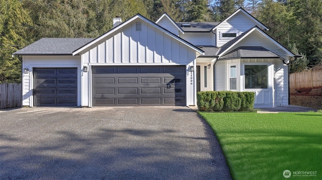 11006 325th Ave SE, Issaquah, WA 98027 - view of front facade with a garage, driveway, board and batten siding, and roof with shingles