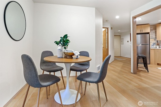 1100 E Harrison St Unit 103, Seattle, WA 98102 - dining area featuring light wood-style flooring and recessed lighting