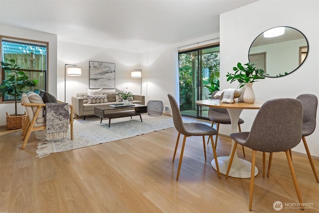 1100 E Harrison St Unit 103, Seattle, WA 98102 - dining area with light wood-style floors