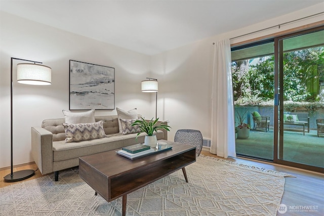 1100 E Harrison St Unit 103, Seattle, WA 98102 - living area with light wood-style floors and baseboards
