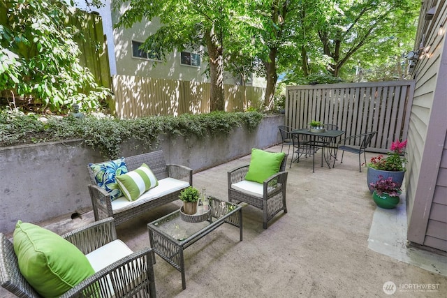 1100 E Harrison St Unit 103, Seattle, WA 98102 - view of patio / terrace featuring an outdoor hangout area and outdoor dining space