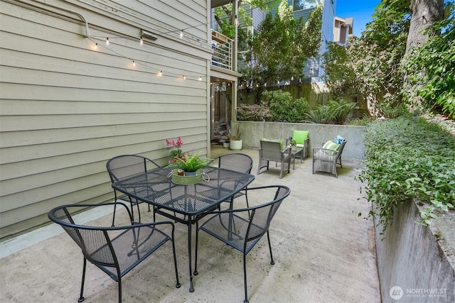 1100 E Harrison St Unit 103, Seattle, WA 98102 - view of patio featuring outdoor dining space
