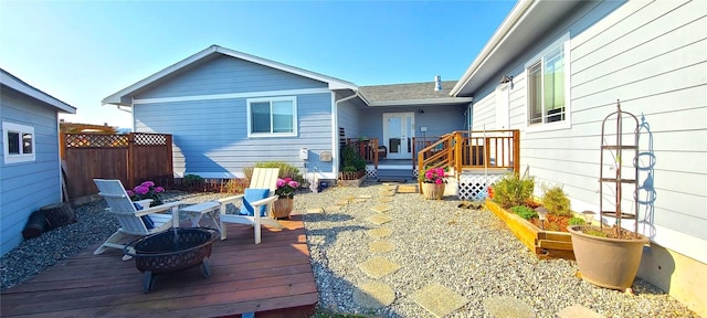 51 Sheree Ln, Sequim, WA 98382 - back of house featuring a deck and an outdoor fire pit
