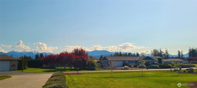 51 Sheree Ln, Sequim, WA 98382 - view of home's community featuring a lawn, curved driveway, a mountain view, and a residential view