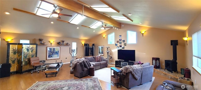 51 Sheree Ln, Sequim, WA 98382 - living area with a wood stove, a ceiling fan, wood finished floors, and a skylight