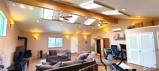 51 Sheree Ln, Sequim, WA 98382 - living area featuring a ceiling fan, a wood stove, an AC wall unit, a desk, and recessed lighting