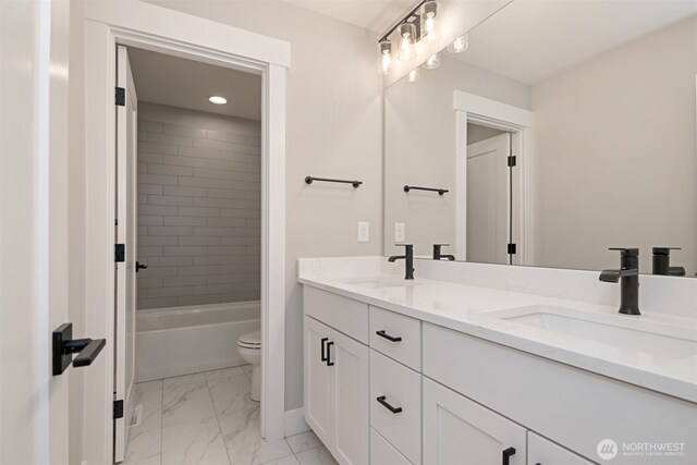 7559 S 130th Pl, Seattle, WA 98178 - full bath featuring double vanity, marble finish flooring, recessed lighting, and shower / bathtub combination