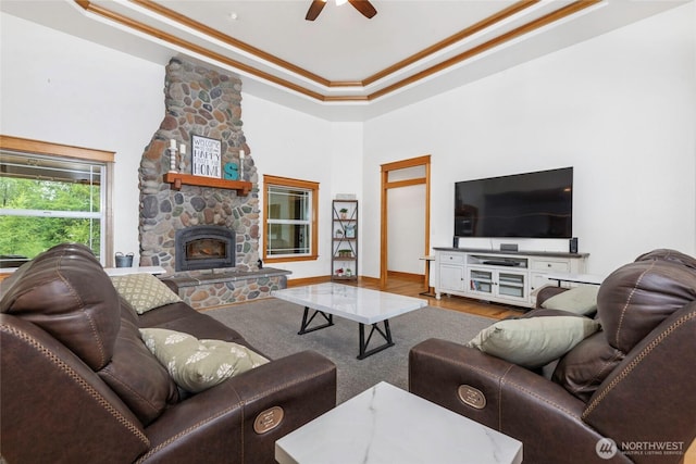 15949 159th Ln SE, Yelm, WA 98597 - living area featuring a raised ceiling, crown molding, ceiling fan, wood finished floors, and a high ceiling