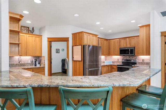 15949 159th Ln SE, Yelm, WA 98597 - kitchen featuring appliances with stainless steel finishes, open shelves, decorative backsplash, a peninsula, and recessed lighting
