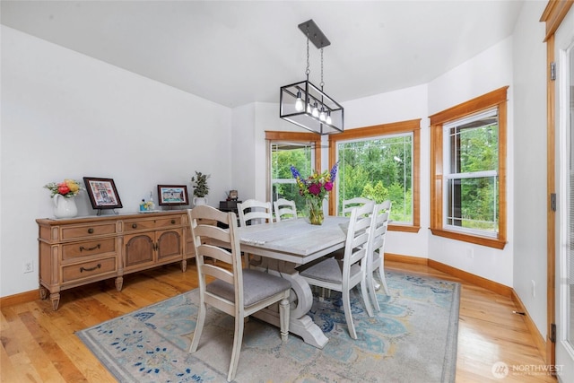 15949 159th Ln SE, Yelm, WA 98597 - dining room with light wood-type flooring and a chandelier