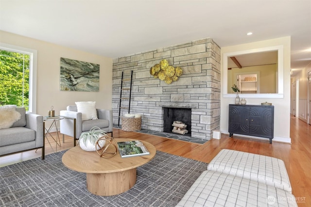 10718 12th Ave NW, Seattle, WA 98177 - living room with a stone fireplace and wood finished floors