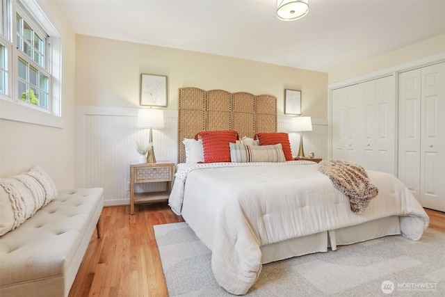 10718 12th Ave NW, Seattle, WA 98177 - bedroom with a wainscoted wall, wood finished floors, and multiple closets