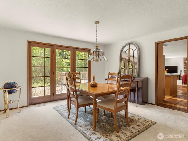 7842 Delphi Rd SW, Olympia, WA 98512 - dining room featuring light carpet and a chandelier
