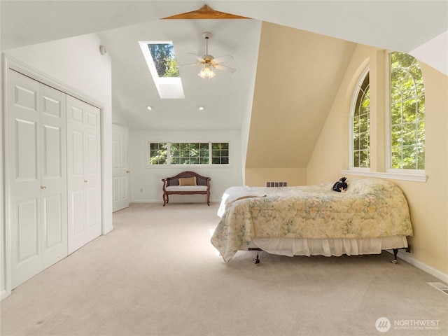 7842 Delphi Rd SW, Olympia, WA 98512 - carpeted bedroom with lofted ceiling, a skylight, a ceiling fan, and a closet