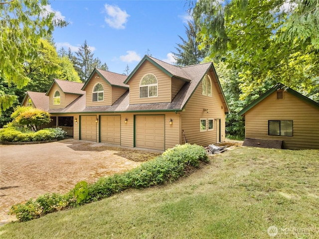 7842 Delphi Rd SW, Olympia, WA 98512 - view of front of house featuring dirt driveway, a front yard, roof with shingles, and a garage
