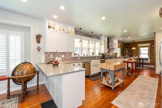281 Jarvis Rd, Mossyrock, WA 98564 - kitchen with a peninsula, dishwasher, light countertops, tasteful backsplash, and glass insert cabinets