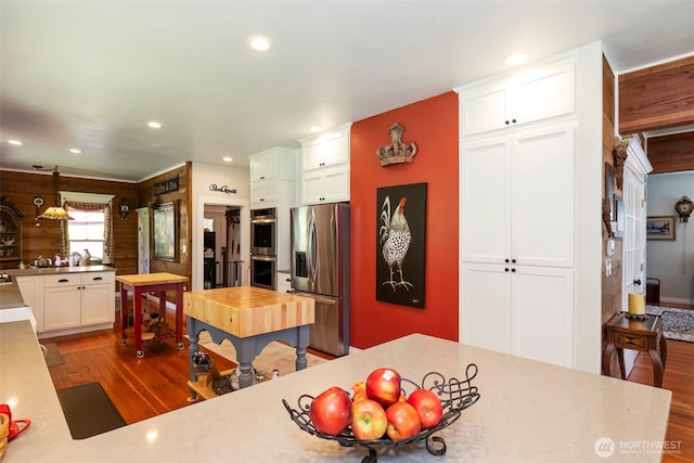 281 Jarvis Rd, Mossyrock, WA 98564 - kitchen featuring stainless steel appliances, wood finished floors, recessed lighting, white cabinets, and light countertops