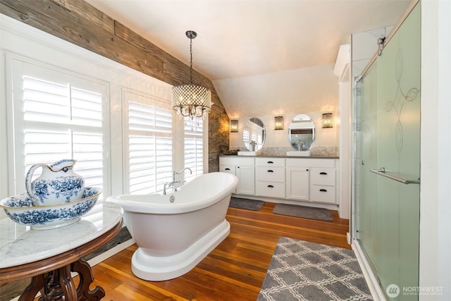 281 Jarvis Rd, Mossyrock, WA 98564 - bathroom with hardwood / wood-style flooring, a shower stall, double vanity, vaulted ceiling, and a freestanding tub