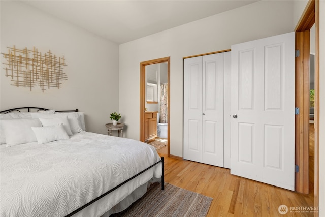 18130 Sunrise Ridge Ave NE, Poulsbo, WA 98370 - bedroom featuring light wood finished floors, a closet, and ensuite bathroom