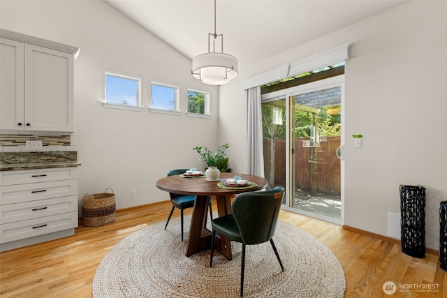 18130 Sunrise Ridge Ave NE, Poulsbo, WA 98370 - dining room with light wood-style flooring and lofted ceiling