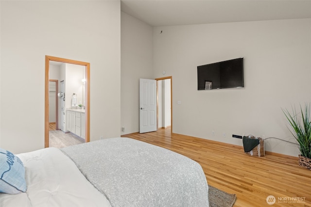18130 Sunrise Ridge Ave NE, Poulsbo, WA 98370 - bedroom with high vaulted ceiling and light wood-type flooring