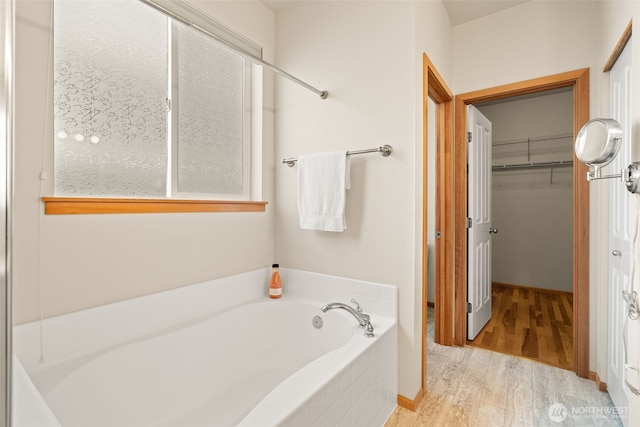 18130 Sunrise Ridge Ave NE, Poulsbo, WA 98370 - full bath with wood finished floors, a bath, and a walk in closet